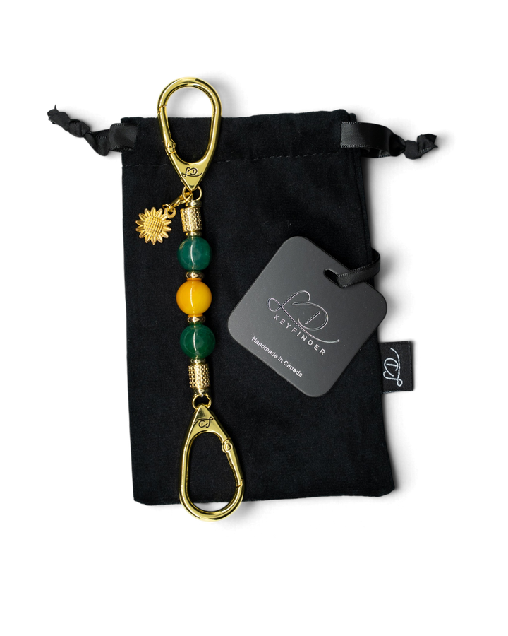 LD Keyfinder Golden Harvest-Mini featuring green and orange agate beads, gold-plated sunflower charm, and velvet bag.