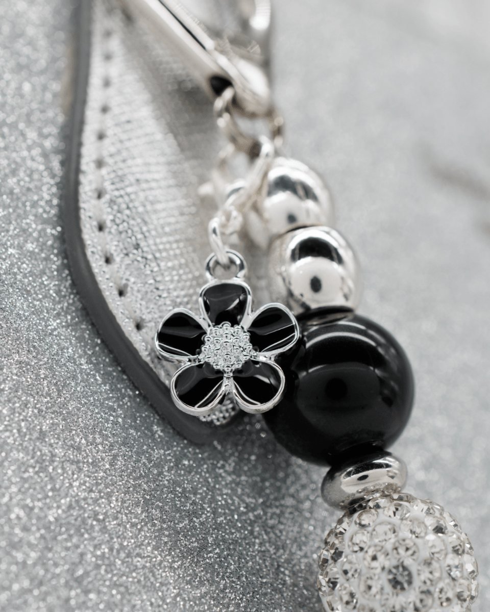 Silver plated black flower charm