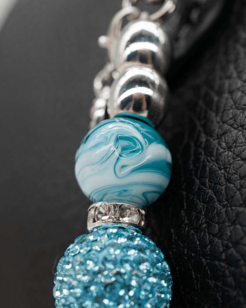 Hand-blown teal swirl glass