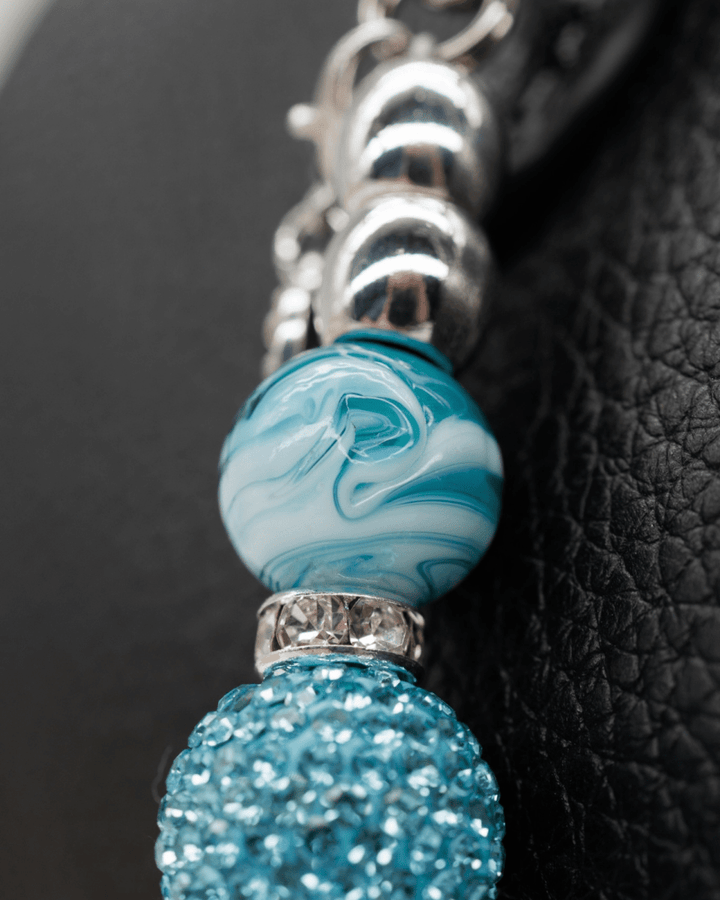 Hand-blown teal swirl glass
