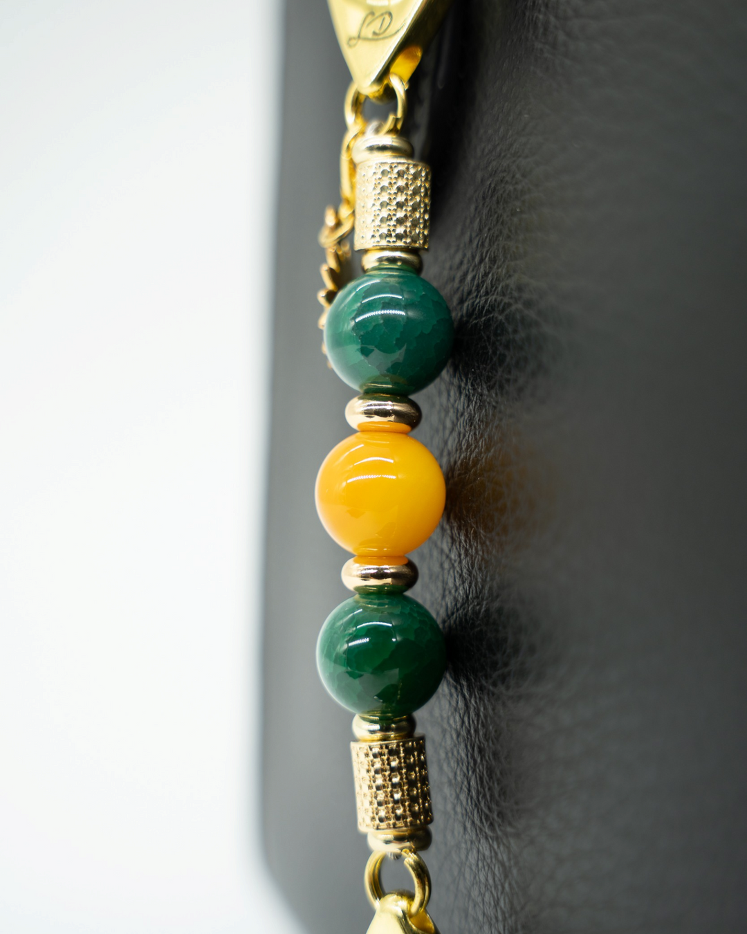 LD Keyfinder Golden Harvest-Mini featuring dark green and orange-yellow agate beads with 18KT gold-plated accents.