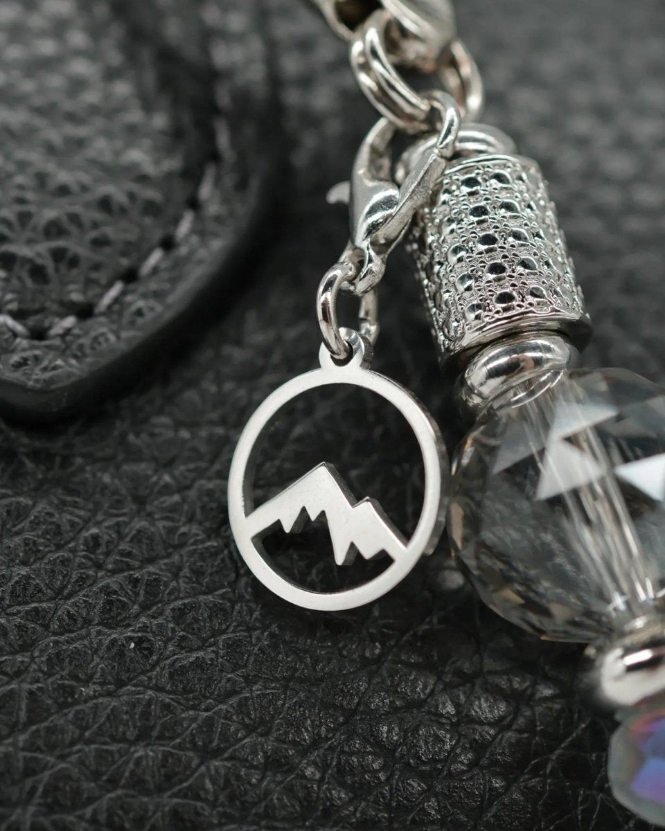 Polished stainless mountain peak charm