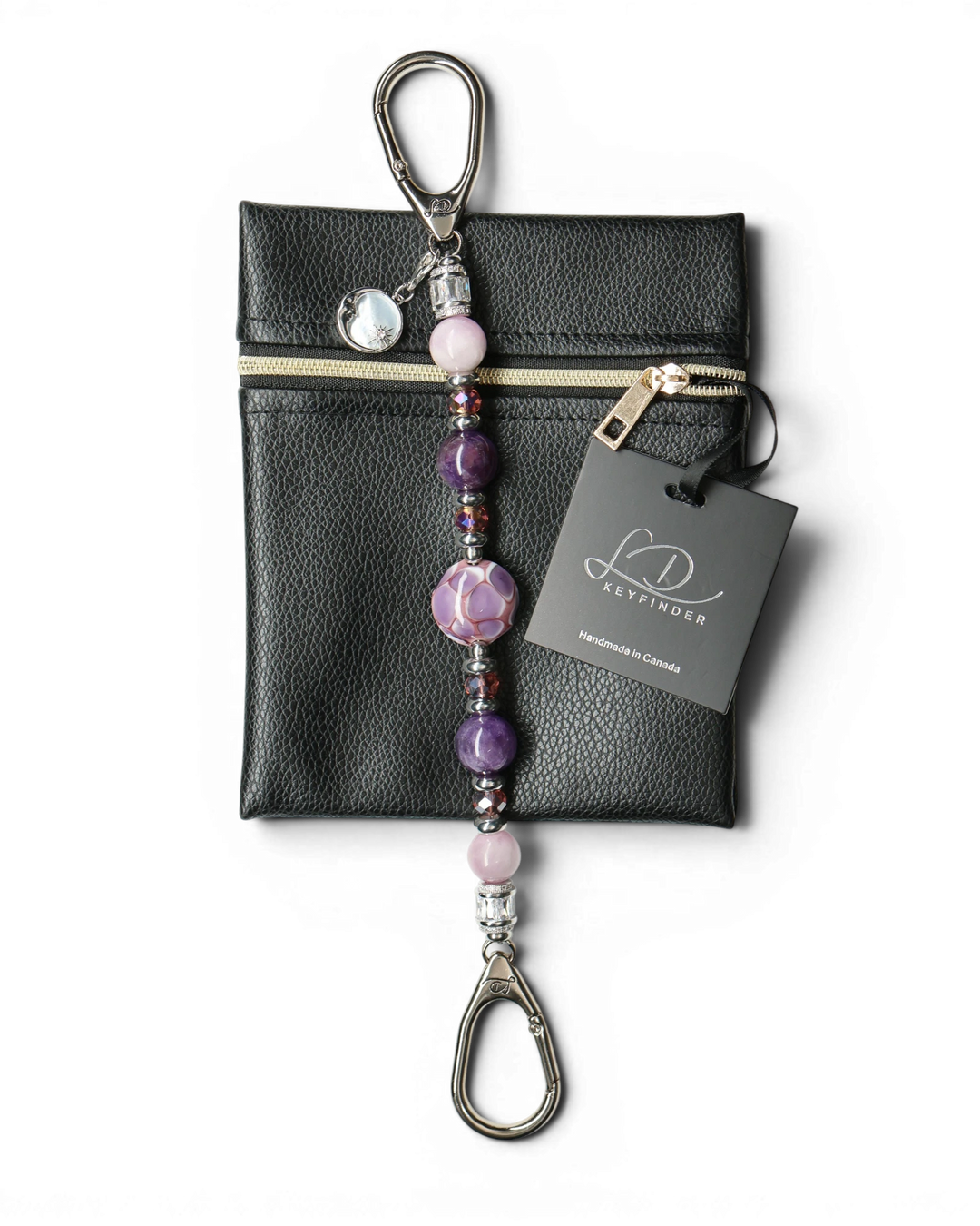 LD Keyfinder Amethyst Moon keychain with purple amethyst, pink kunzite, glass beads, and moon charm on black pouch.
