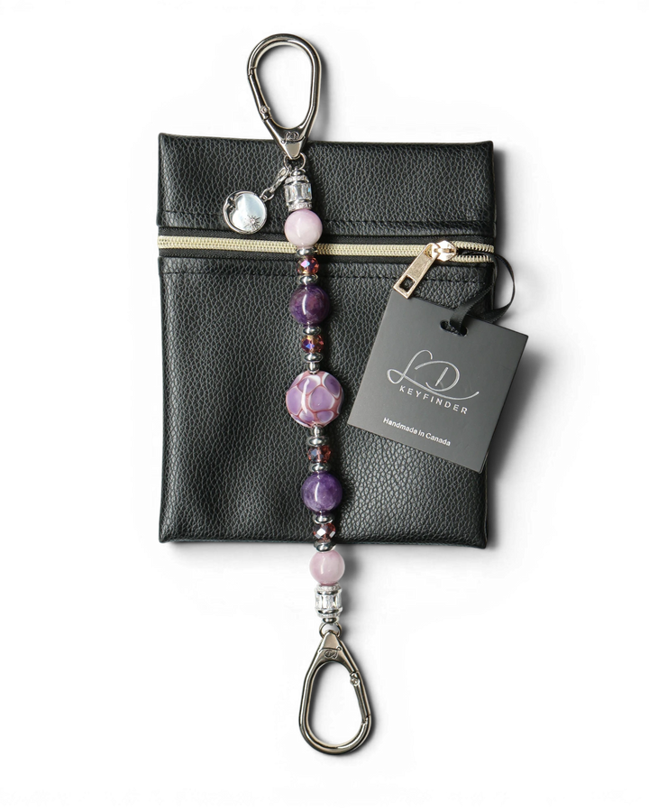LD Keyfinder Amethyst Moon keychain with purple amethyst, pink kunzite, glass beads, and moon charm on black pouch.