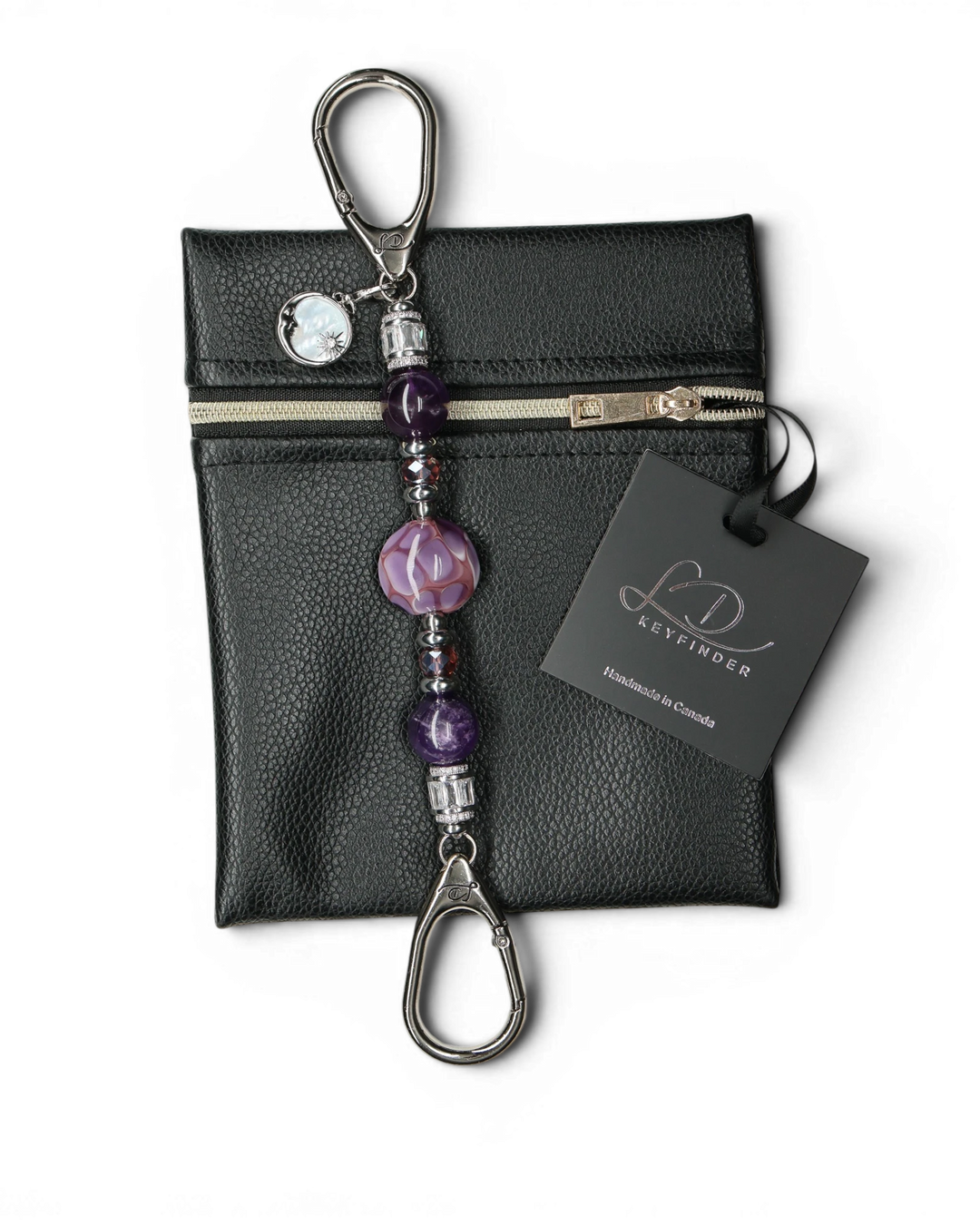 LD Keyfinder Petite Amethyst Moon keychain with amethyst, glass beads, and moon charm on black pouch.