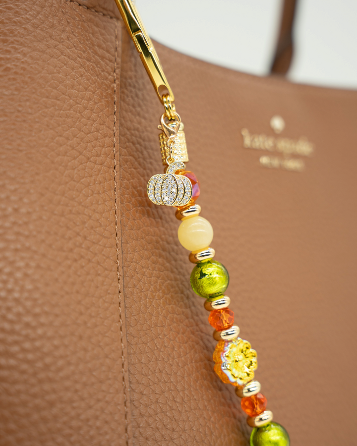 LD Keyfinder Autumn Festival bag charm with green foil glass, orange beads, yellow jade, and a rhinestone pumpkin