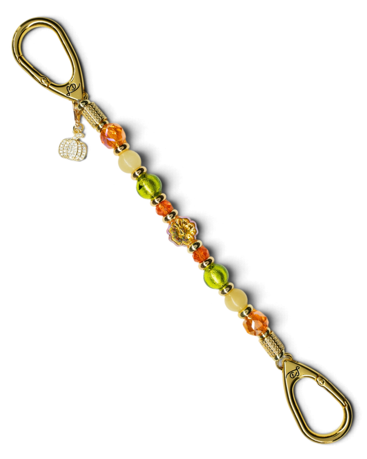 LD Keyfinder Autumn Festival accessory with green foil, orange glass, yellow jade beads, and a gold pumpkin charm.