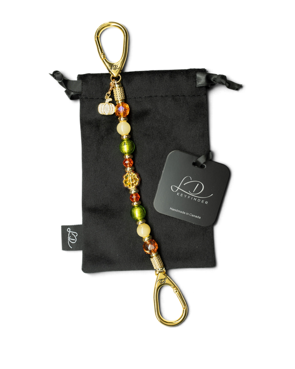 LD Keyfinder Autumn Festival beaded keychain with green foil, orange glass, yellow jade, and a gold pumpkin charm.