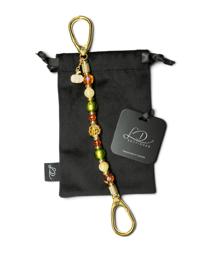 LD Keyfinder Autumn Festival beaded keychain with green foil, orange glass, yellow jade, and a gold pumpkin charm.