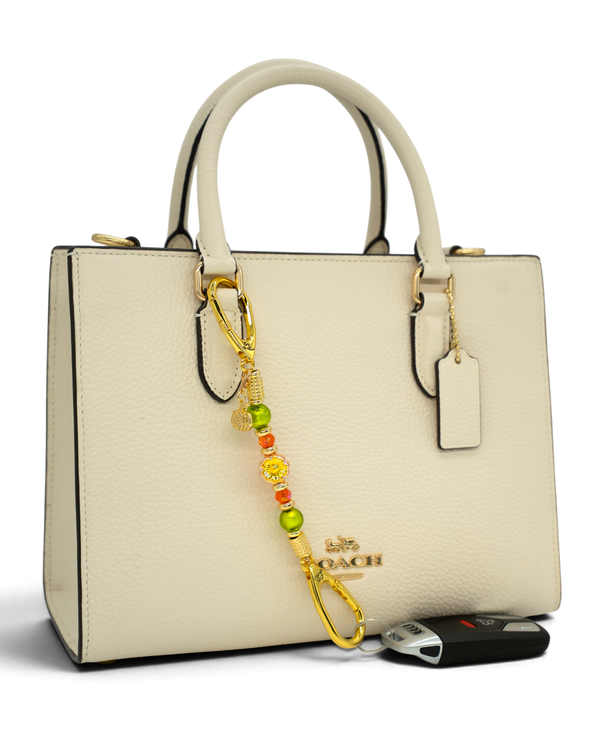 LD Keyfinder Autumn Festival-Mini featuring green foil beads, orange glass beads, a flower charm, and gold accents.