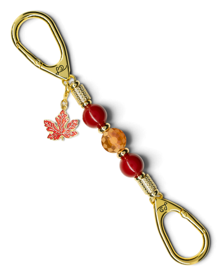 LD Keyfinder Autumn Glow-Mini keychain with red shell pearls, amber glass bead, gold spacers, and maple leaf charm.