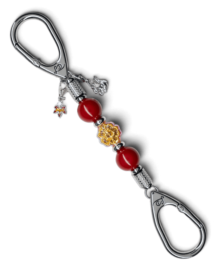 LD Keyfinder Autumn Whispers Mini featuring red shell pearls, orange glass flower, and platinum-plated charms.
