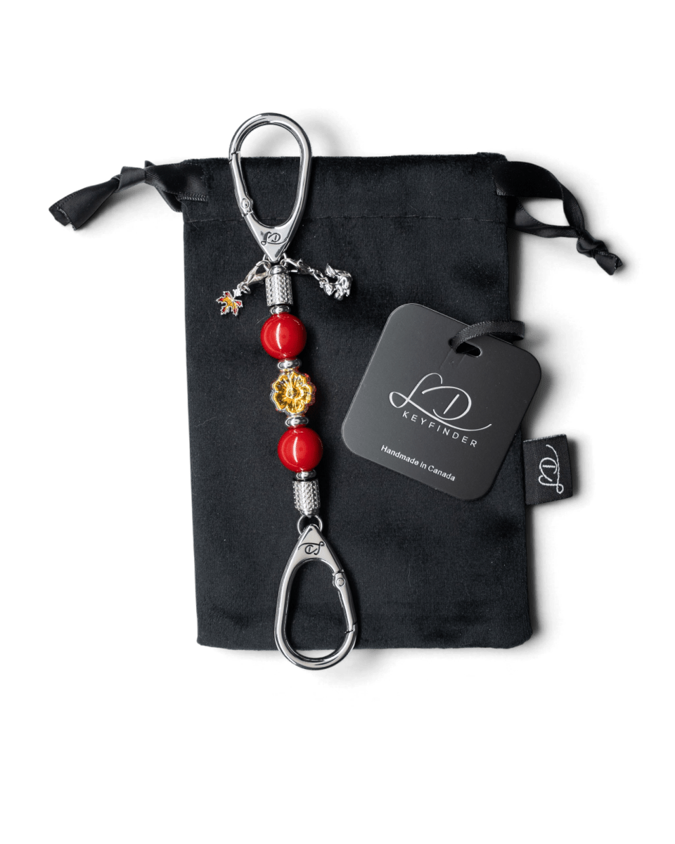 LD Keyfinder Autumn Whispers Mini featuring red shell pearls, orange glass flower, and platinum-plated charms.