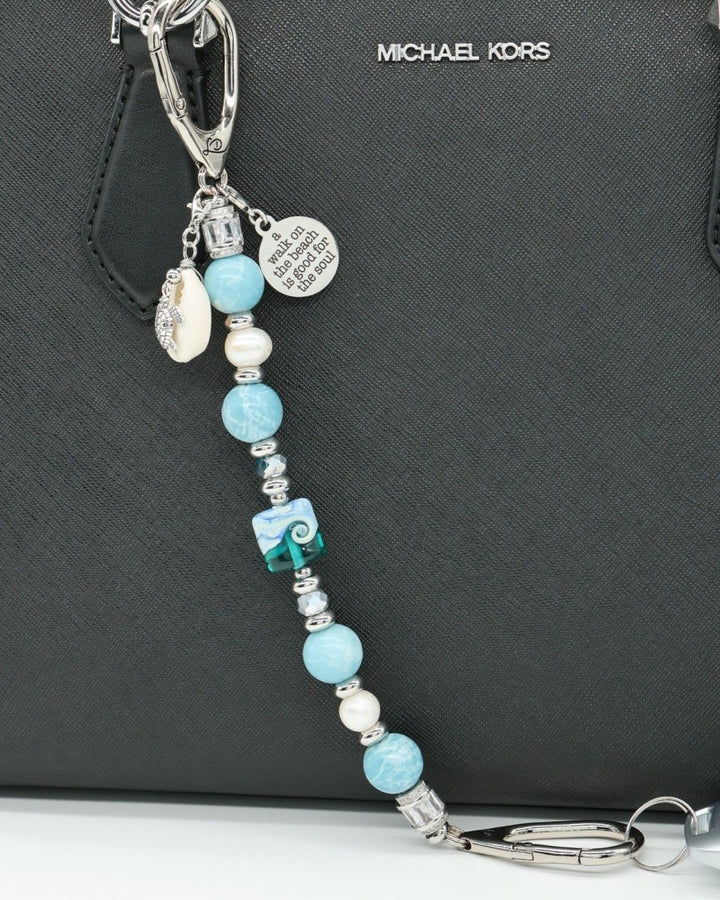 LD Keyfinder Beachy Dreams keychain with blue, teal, and white beads, a shell, turtle charm, and inspirational quote charm.