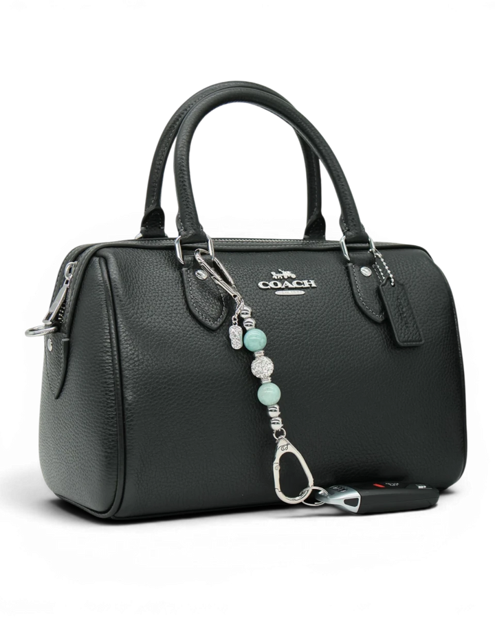 LD Keyfinder Beachside Bliss Mini beaded charm with aqua jade and crystal beads attached to a black leather handbag.