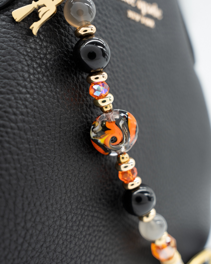 LD Keyfinder Bewitched Halloween accessory with black obsidian, moonstone, orange glass beads, and a gold witch charm.
