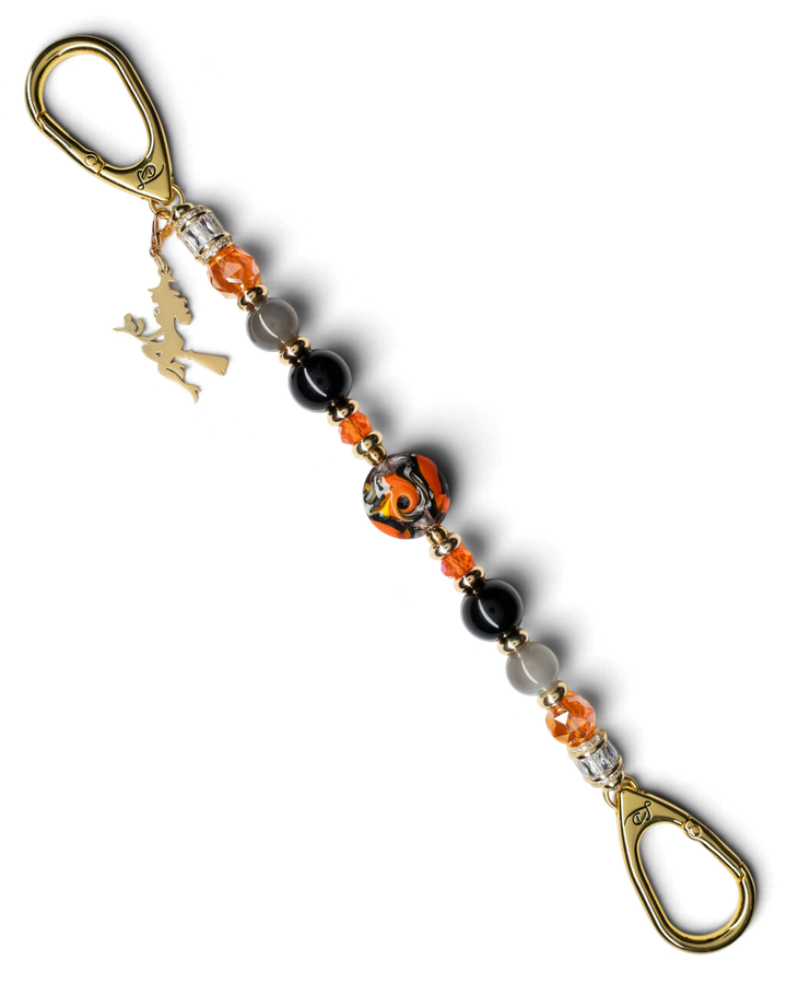 LD Keyfinder Bewitched Halloween accessory featuring black obsidian, moonstone, orange glass beads, and a gold witch charm.