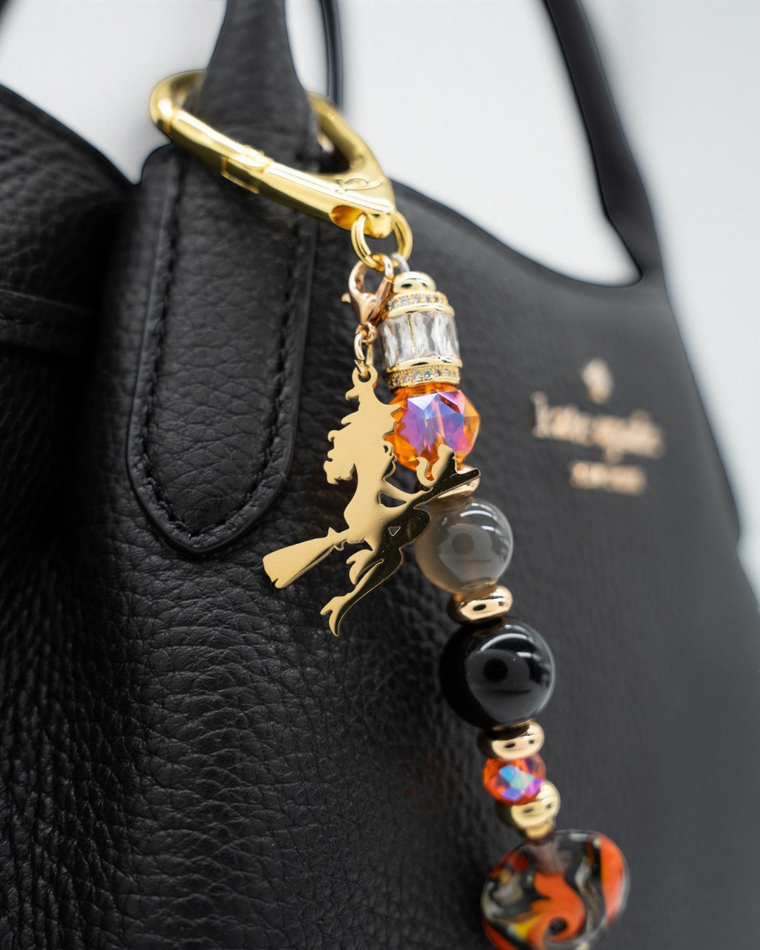 LD Keyfinder Bewitched Halloween accessory featuring black obsidian, moonstone, orange glass beads, and a gold witch charm