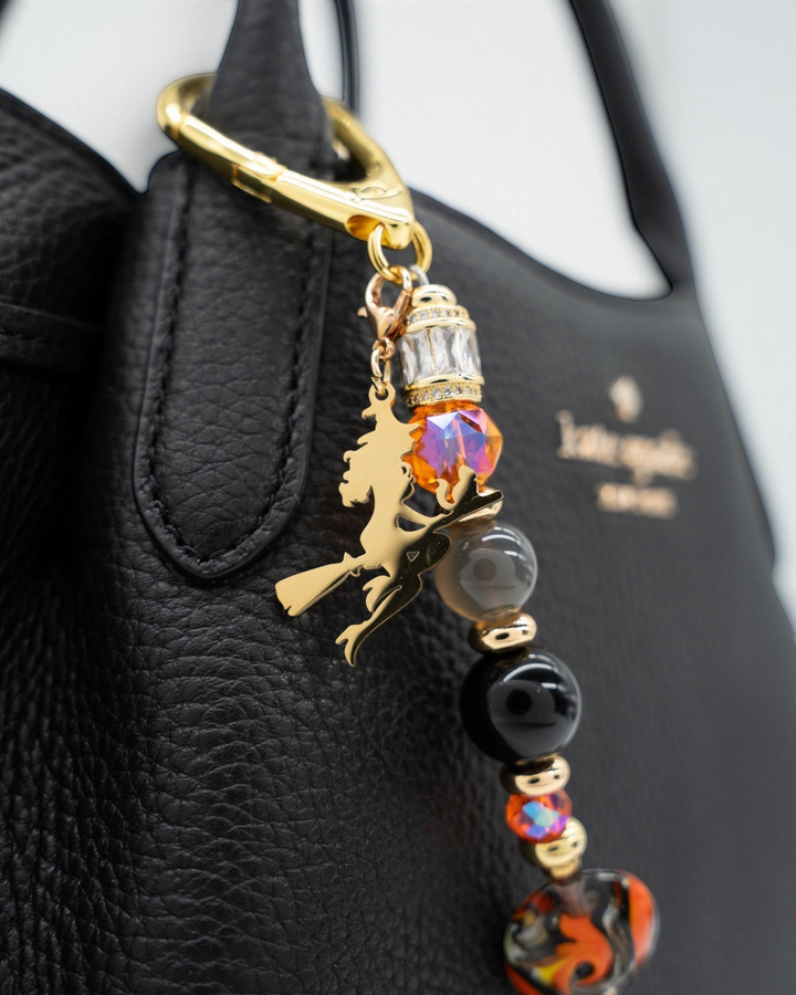 LD Keyfinder Bewitched Halloween accessory featuring black obsidian, moonstone, orange glass beads, and a gold witch charm