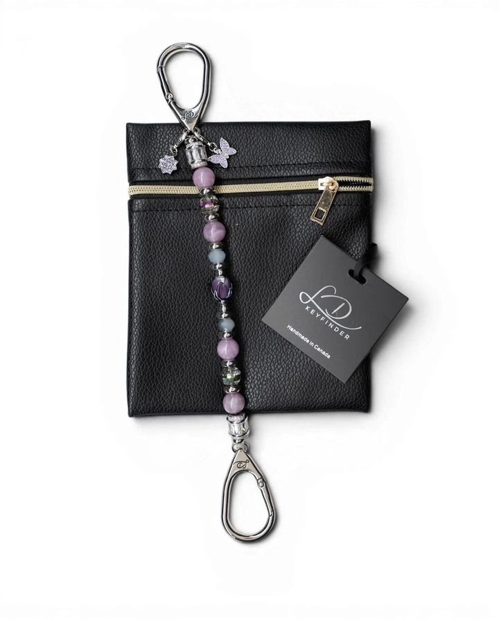 LD Keyfinder Blooming Joy beaded keychain with Lepidolite, Jade, glass tulip, and charms on a black leather pouch.