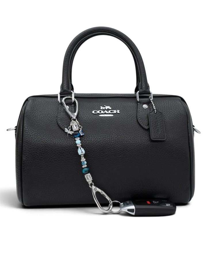 LD Keyfinder Petite Whispering Garden beaded keychain with blue glass tulip, tiger eye, and dragonfly charm on a black bag