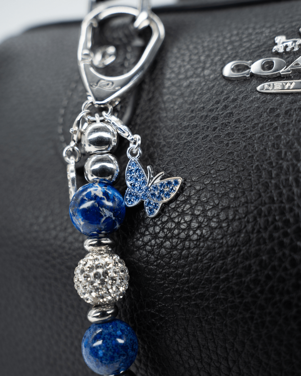 LD Keyfinder Blue Butterfly-Mini charm with blue pearlized beads, rhinestone spacers, and a silver butterfly pendant.