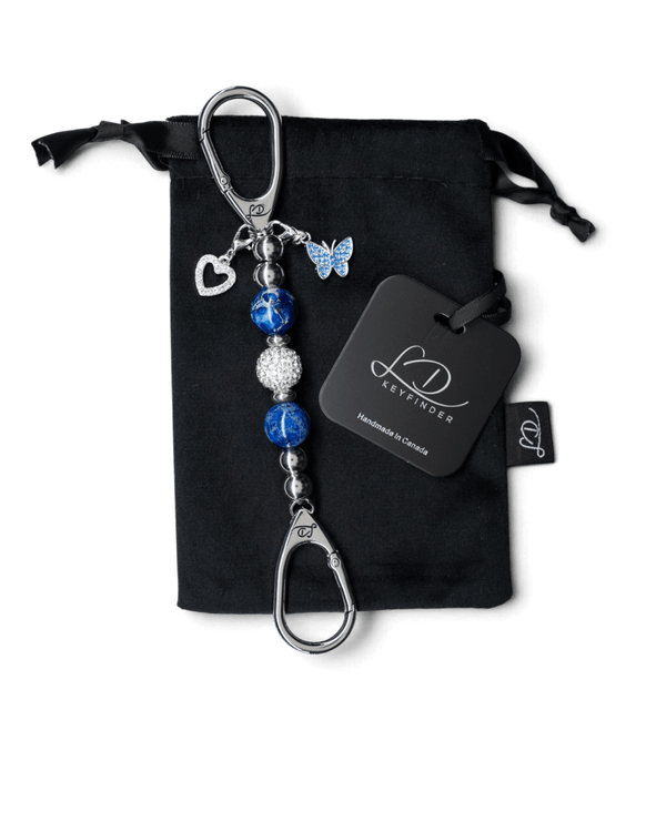 LD Keyfinder Blue Butterfly-Mini keychain with blue pearlized beads, crystal center, and heart and butterfly charms.