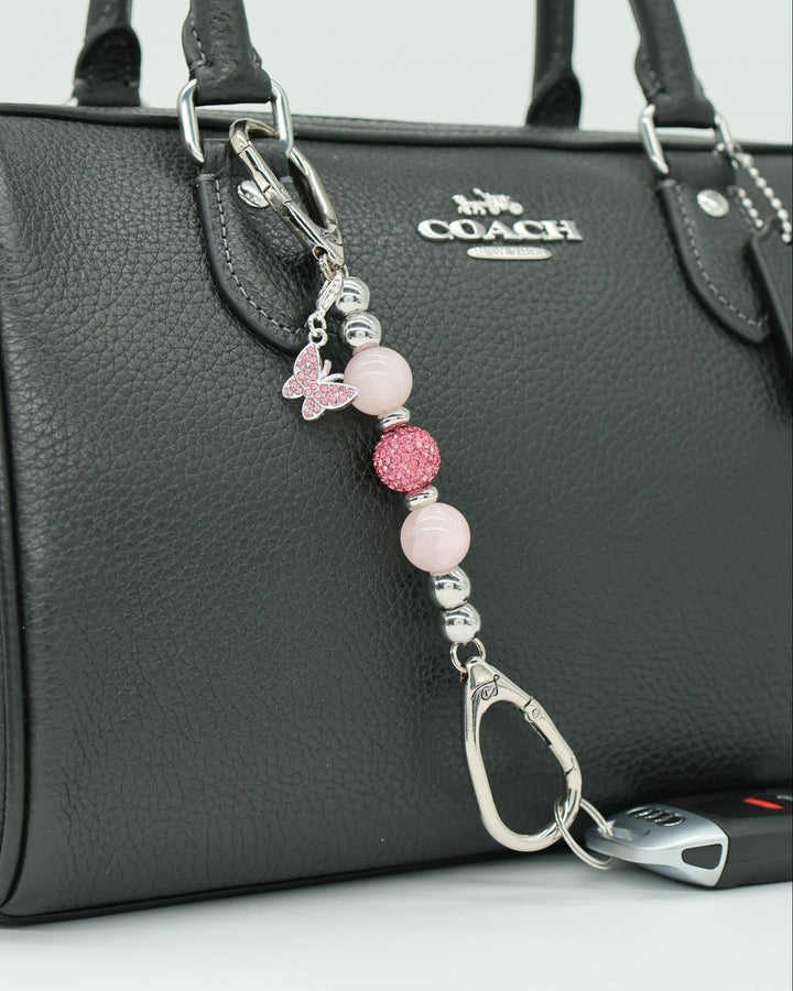 LD Keyfinder Blush Butterfly Mini keychain with rose quartz, Austrian crystals, and pink rhinestone butterfly charm.