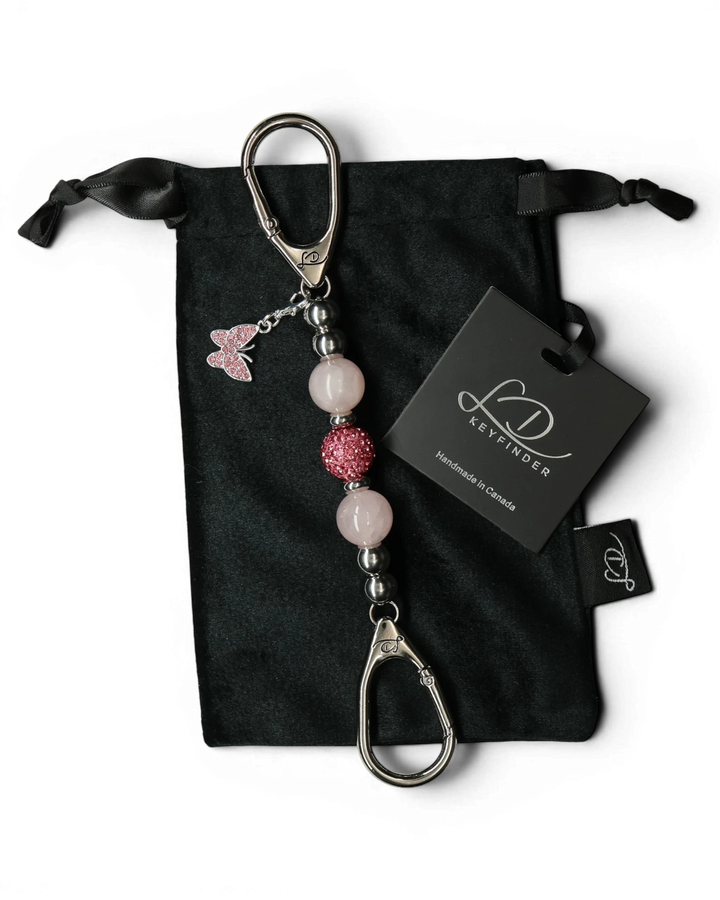 LD Keyfinder Blush Butterfly Mini keychain with rose quartz beads, Austrian crystals, and pink rhinestone butterfly charm.