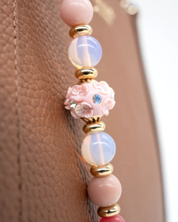 LD Keyfinder Blush Sorbetto beaded accessory with pink floral artisan bead, Rhodochrosite, Pink Opal, and gold accents.