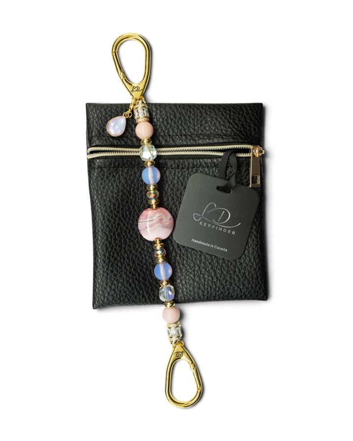 LD Keyfinder Blushing Opaline beaded keychain with pink opal, artisan glass, and gold-plated accents on a leather pouch