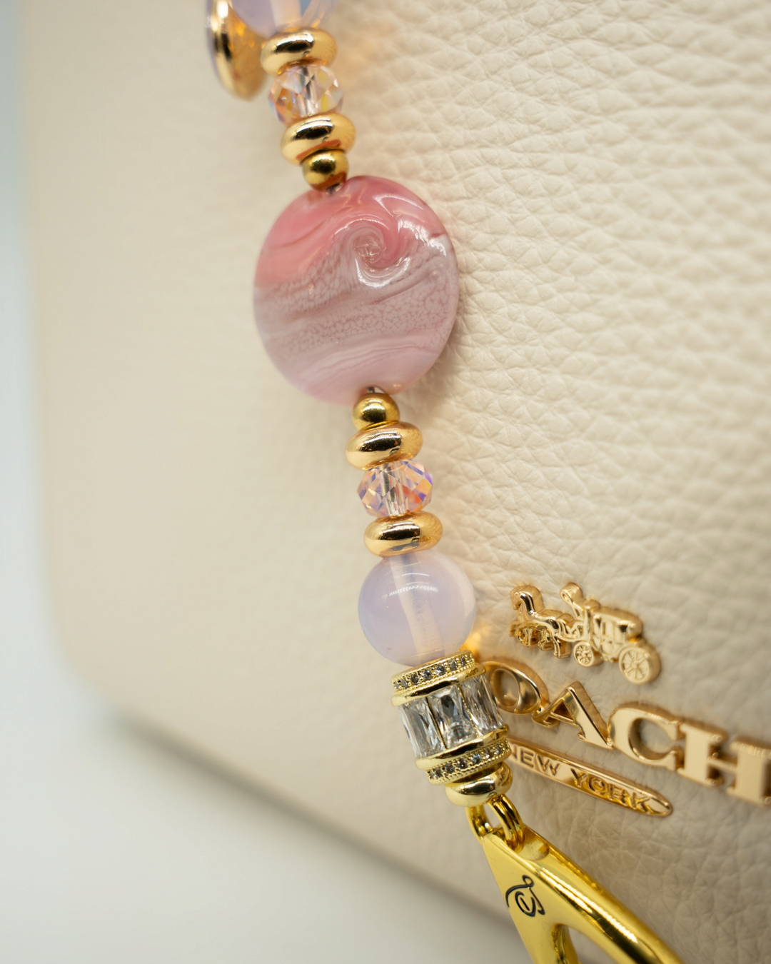 LD Keyfinder Blushing Opaline Petite featuring pink artisan glass, opalite beads, and 18KT gold-plated accents.