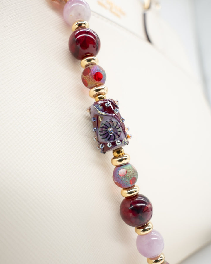 LD Keyfinder Bordeaux Bloom beaded accessory with burgundy agate, lavender kunzite, artisan glass, and gold accents.