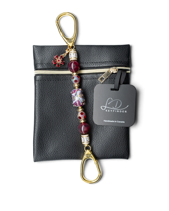 LD Keyfinder Petite Bordeaux Bloom beaded keychain with burgundy agate, artisan glass, and gold-plated flower charm.