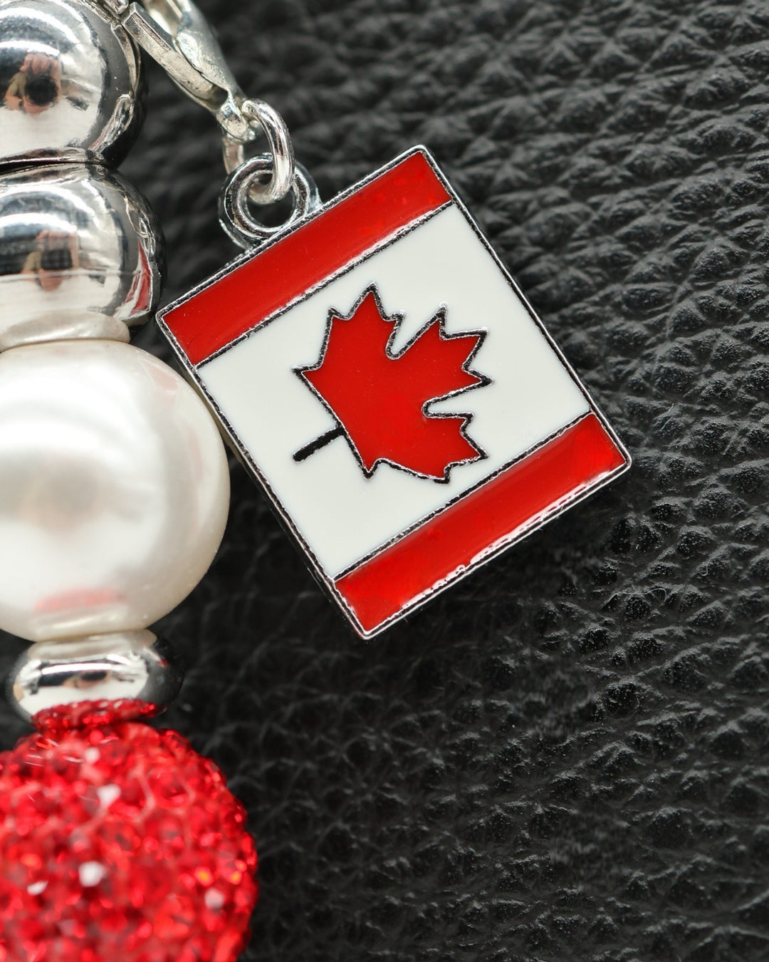 LD Keyfinder Oh Canada Shimmer bracelet charm with pearl, red crystal, and Canada flag charm.