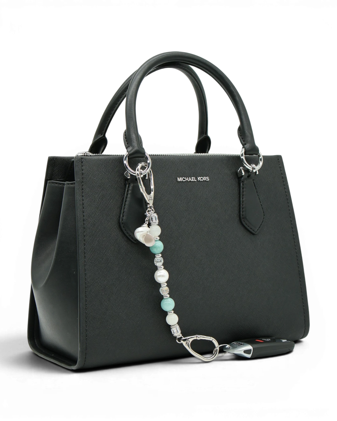 LD Keyfinder Caribbean Pearl beaded accessory featuring moonstone, aqua jade, and shell pearl attached to a black bag.