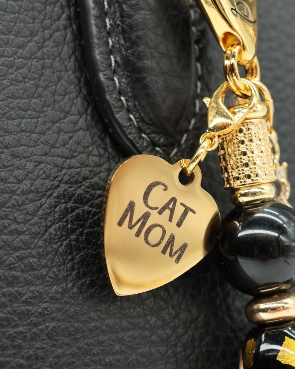 LD Keyfinder Golden Purrs-Mini featuring a gold Cat Mom heart charm, black obsidian beads, and gold-plated accents.