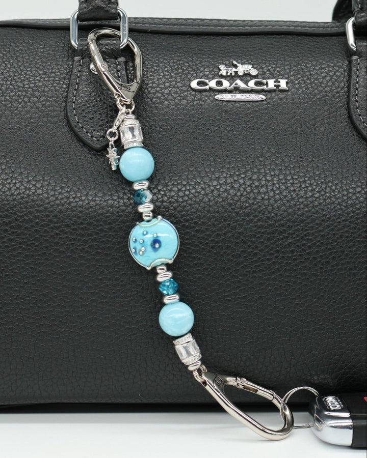 LD Keyfinder Petite Celestial Tide keychain with turquoise, aqua, and silver beads and a star charm.