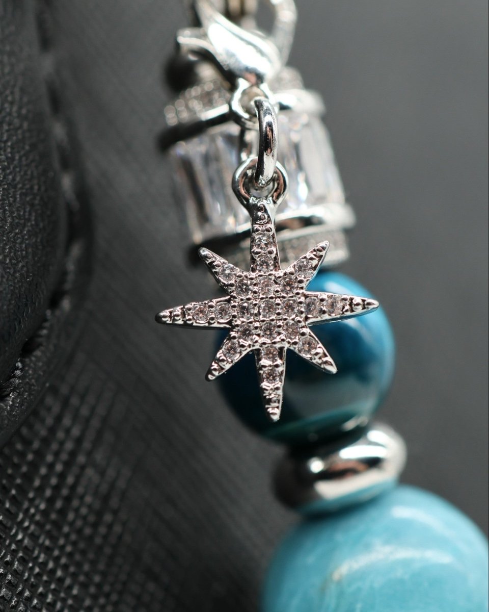 LD Keyfinder Celestial Tide bracelet with blue teal tiger eye, synthetic larimar beads, and a platinum-plated micropavé star charm.