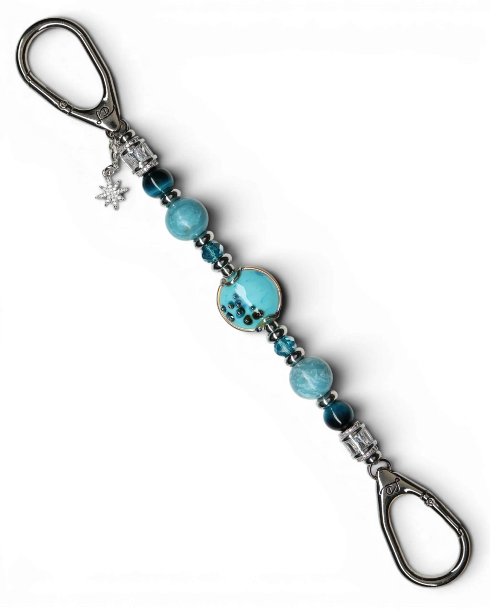 LD Keyfinder Celestial Tide keychain with turquoise glass bead, blue tiger eye, larimar, and silver accents, featuring a star charm.
