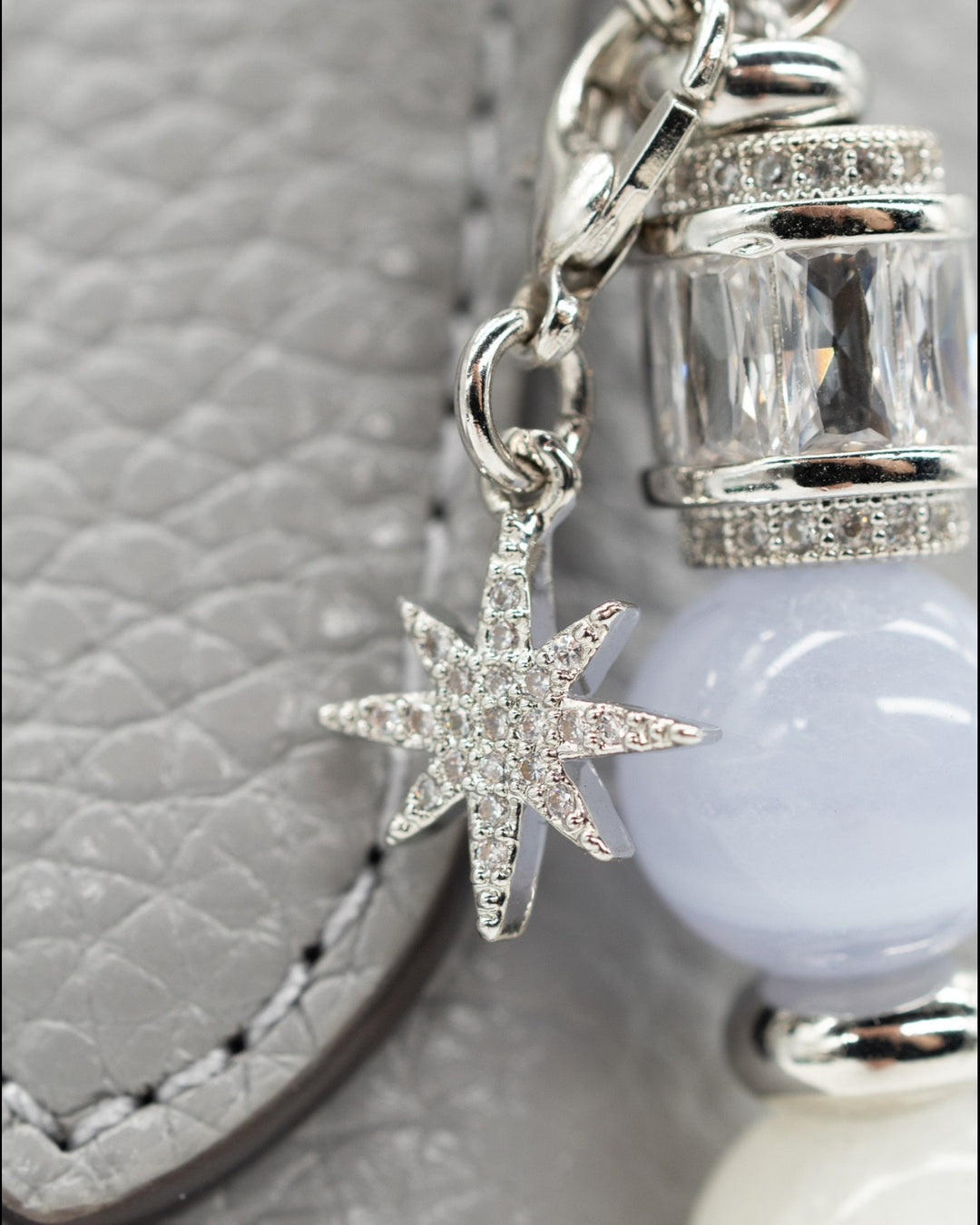 LD Keyfinder Cloud Dancer accessory featuring a pavé star charm, blue lace agate, and platinum-plated baguette beads.
