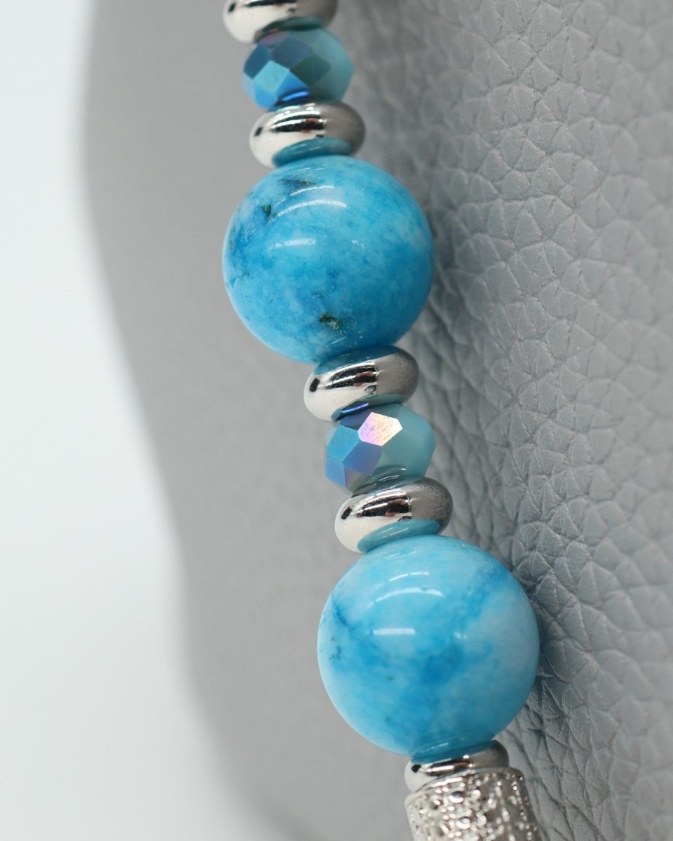 LD Keyfinder Coastal Tide bracelet with aqua hemimorphite beads, crystal center bead, and silver charms.