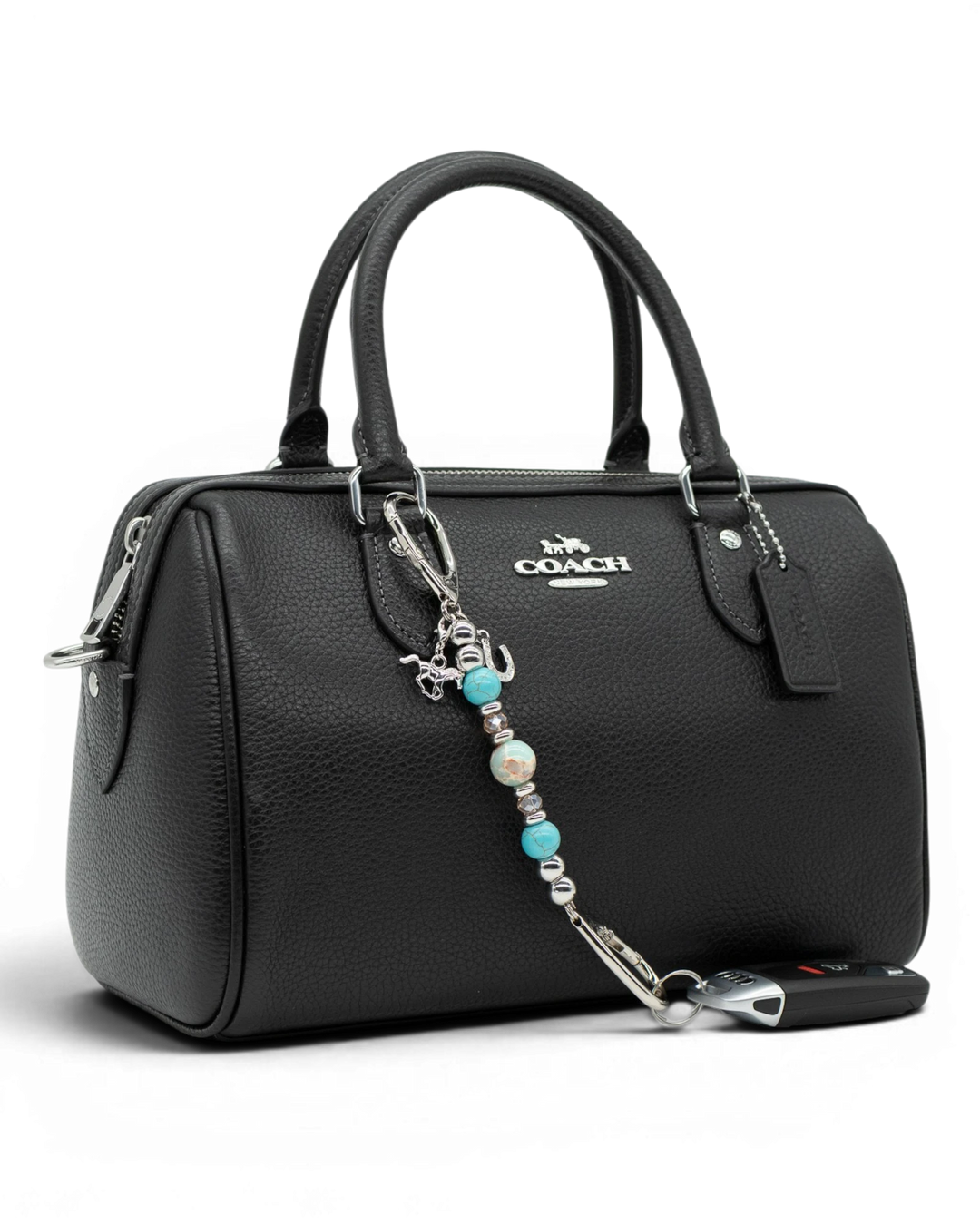 LD Keyfinder Cowgirl Dreams Mini western charm with turquoise, jasper, and horse charms attached to a black handbag.
