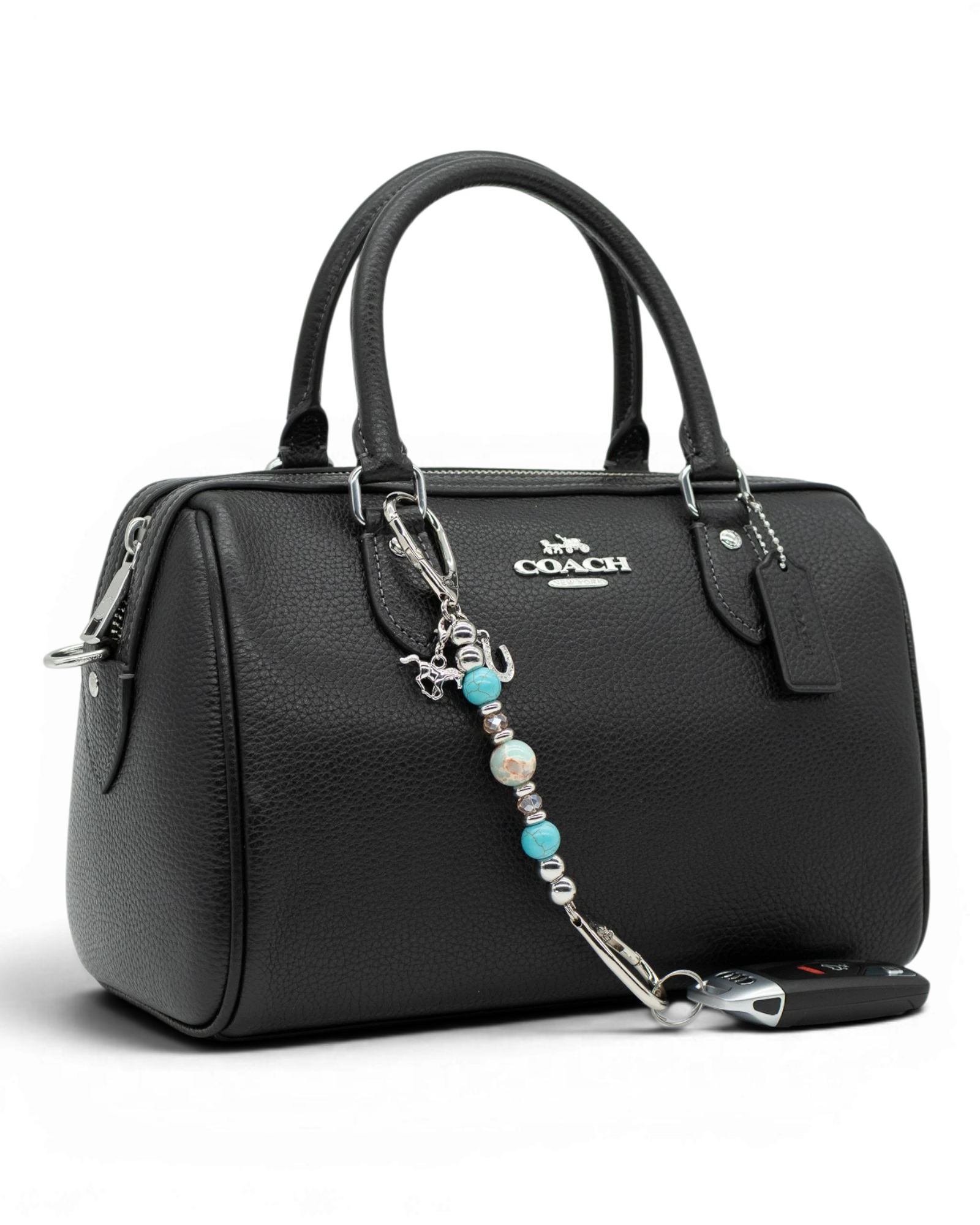 LD Keyfinder Cowgirl Dreams Mini western charm with turquoise, jasper, and horse charms attached to a black handbag.