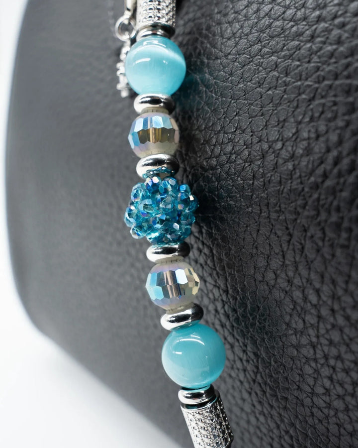 LD Keyfinder Dolphin Dream Mini featuring aqua cat's eye beads, faceted glass, and a rhinestone dolphin charm.