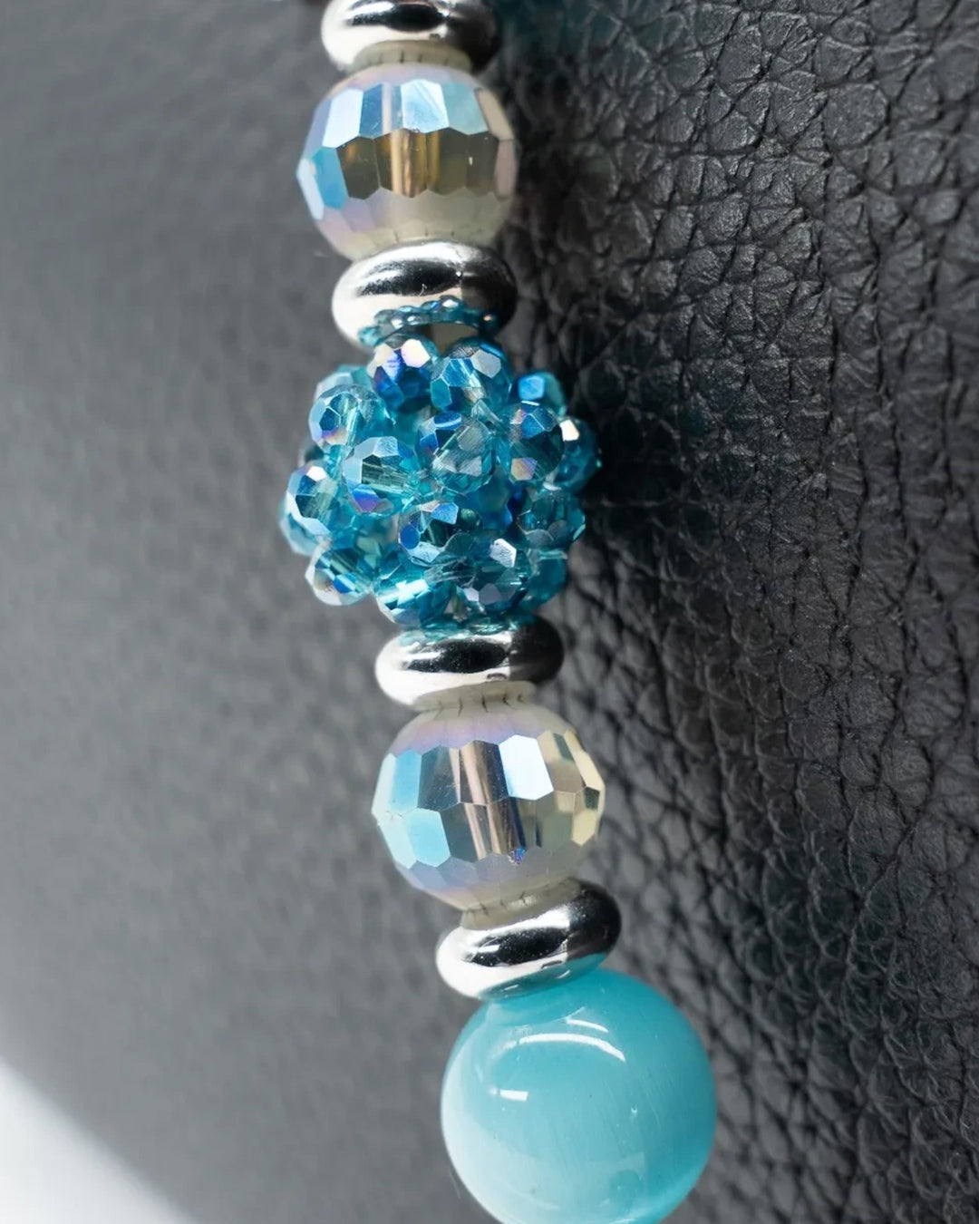 LD Keyfinder Dolphin Dream Mini featuring aqua cat's eye beads, faceted glass, and a rhinestone dolphin charm.