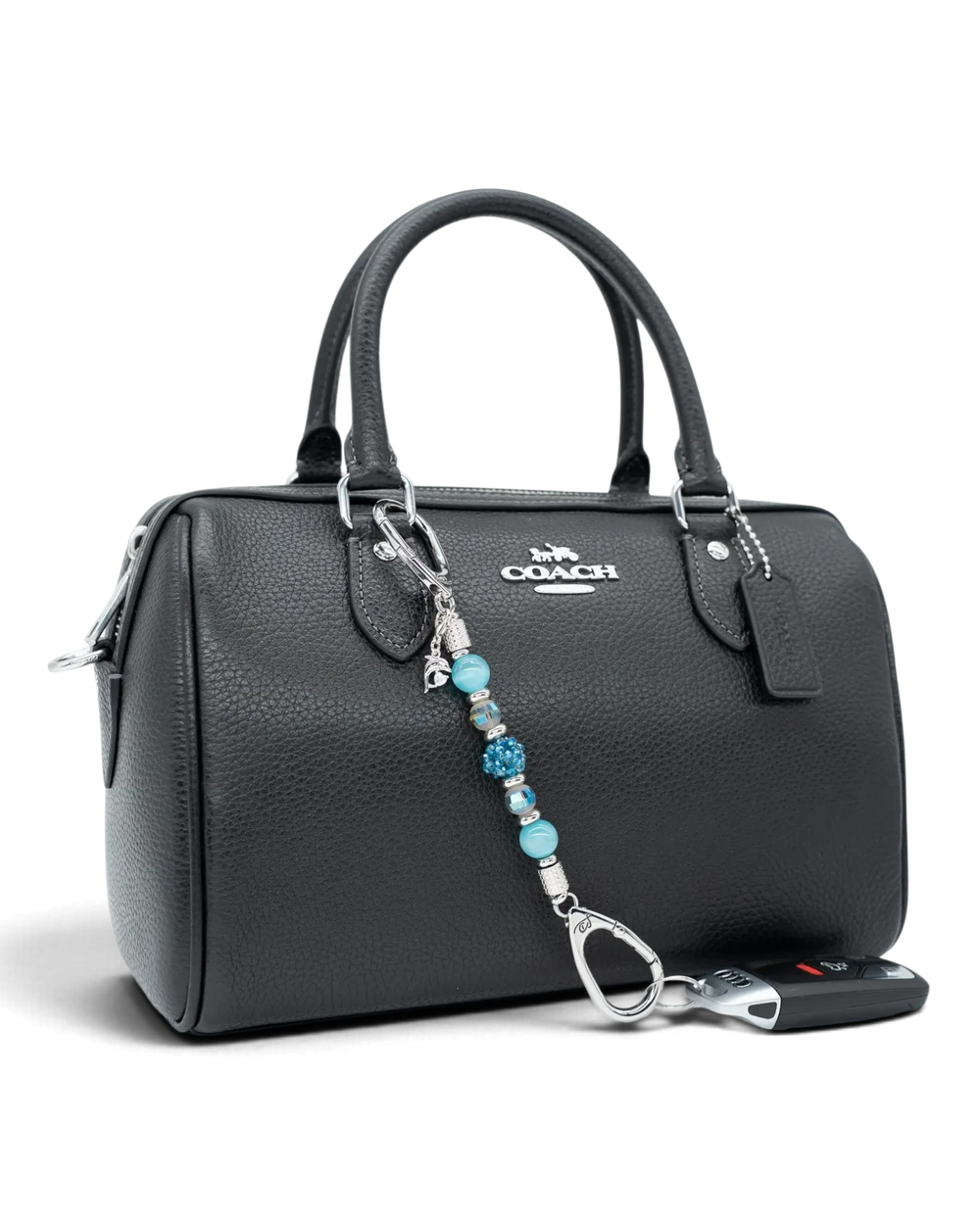 LD Keyfinder Dolphin Dream Mini beaded keychain with aqua glass beads and a rhinestone dolphin charm on a black bag.