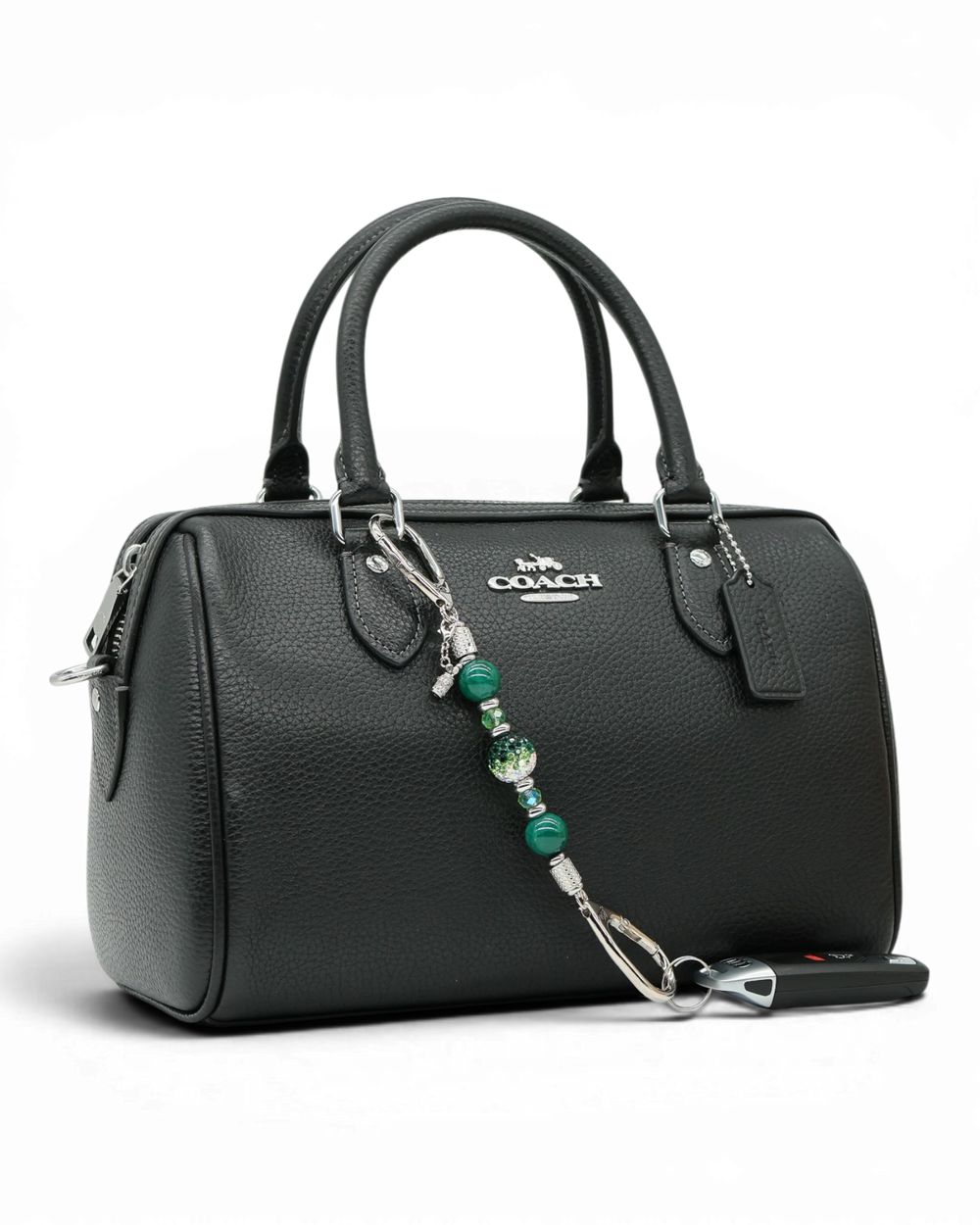 LD Keyfinder Emerald Links-Mini featuring green glass beads, Austrian crystals, and a golf bag charm on a black purse.