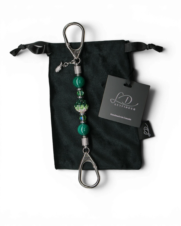 LD Keyfinder Emerald Links-Mini with green glass beads, Austrian crystal center, and golf bag charm on velvet pouch.