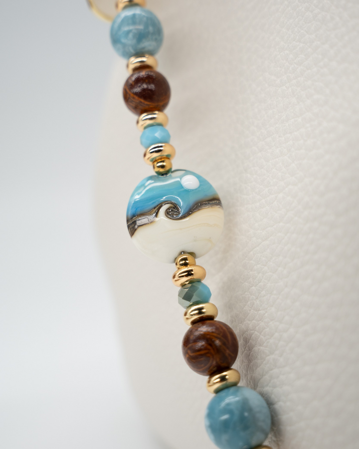 LD Keyfinder Equinox Harmony beaded accessory with artisan glass moon bead, moonstone, larimar, and gold-plated accents.